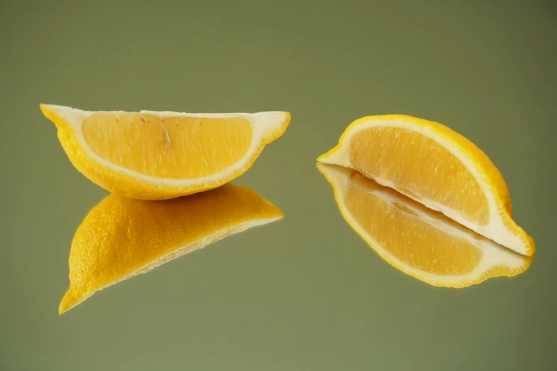 a peeled lemon fruit cut in half sitting on a table