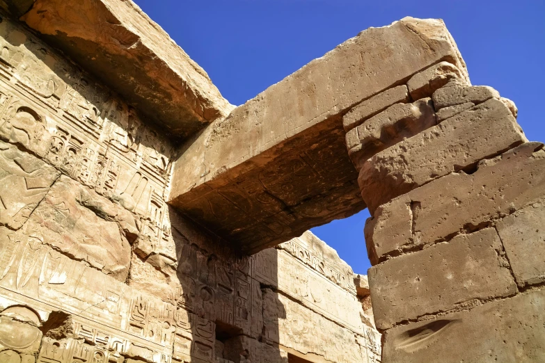 a stone structure with two pieces on the wall