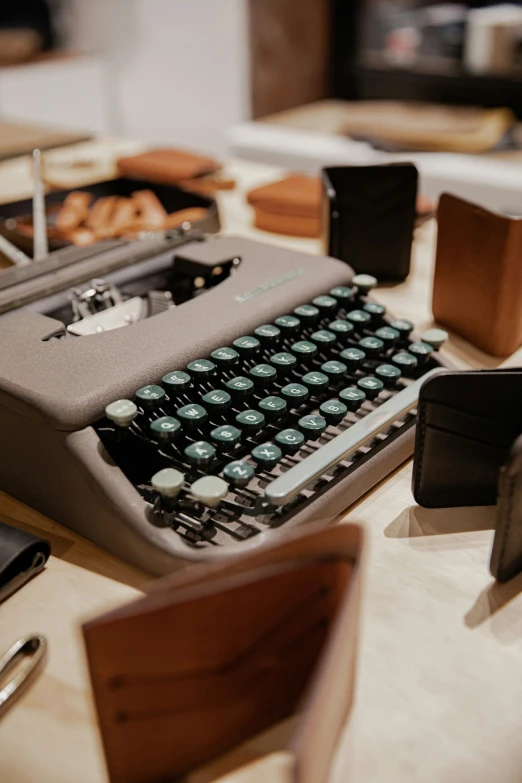 there is an old typewriter and a cup of coffee on the table