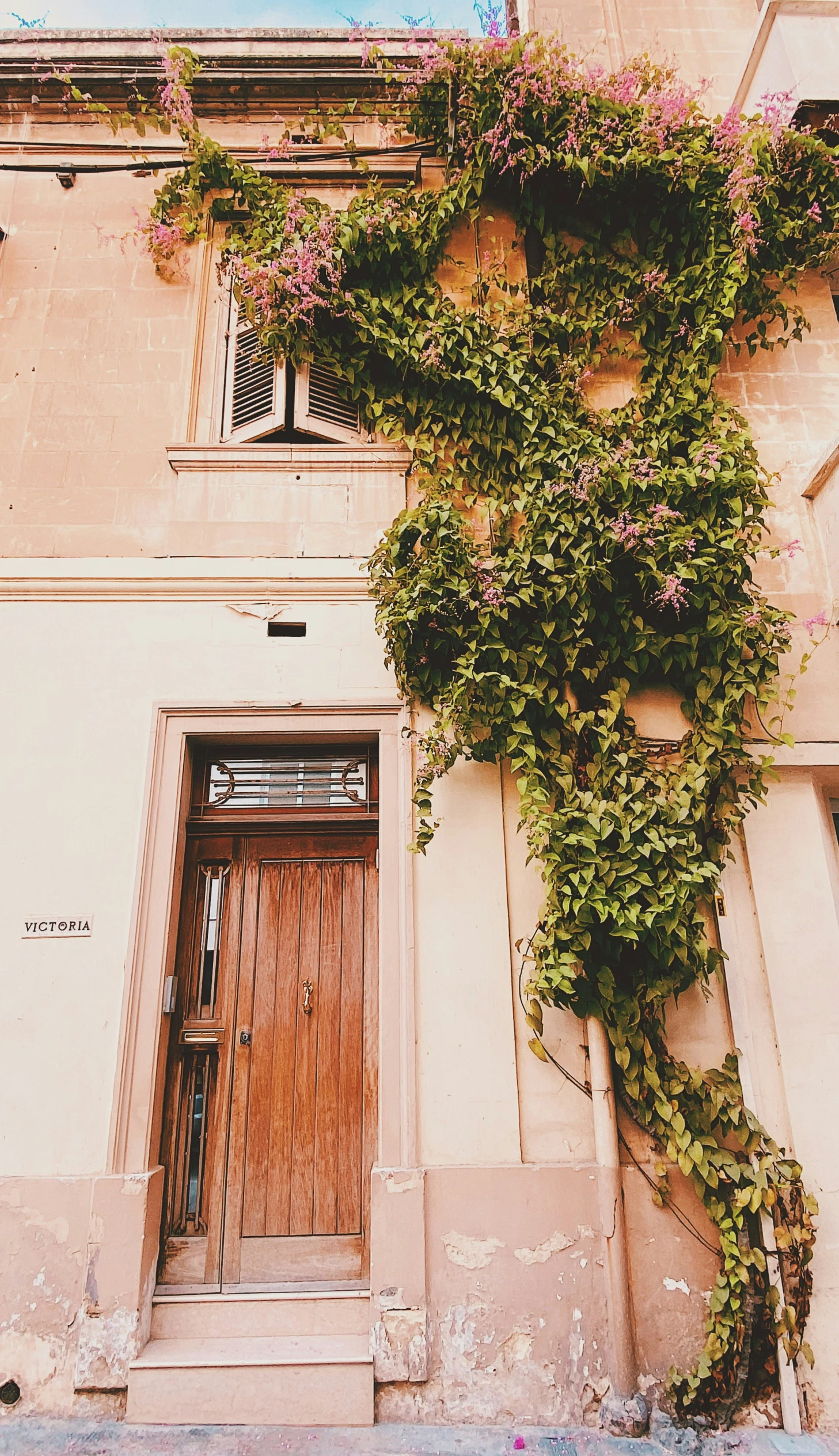 a very tall building with a wooden door