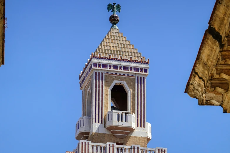 a tall clock tower with a sky background