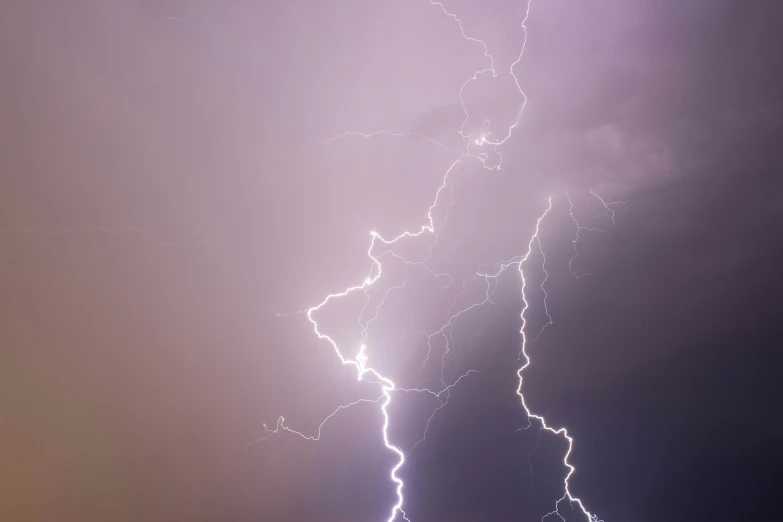 some kind of lightning coming from behind a building