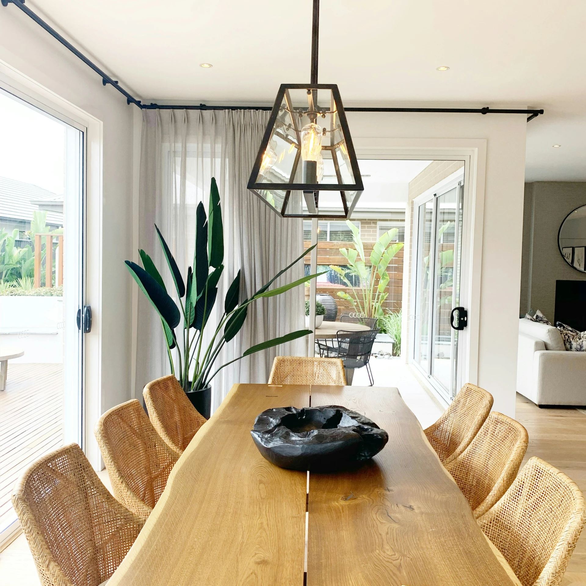 a large wooden table topped with a bowl of food