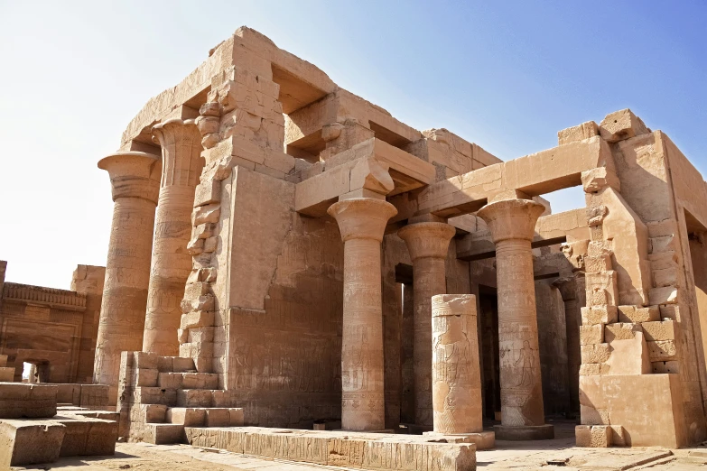 an ancient building is seen here with pillars