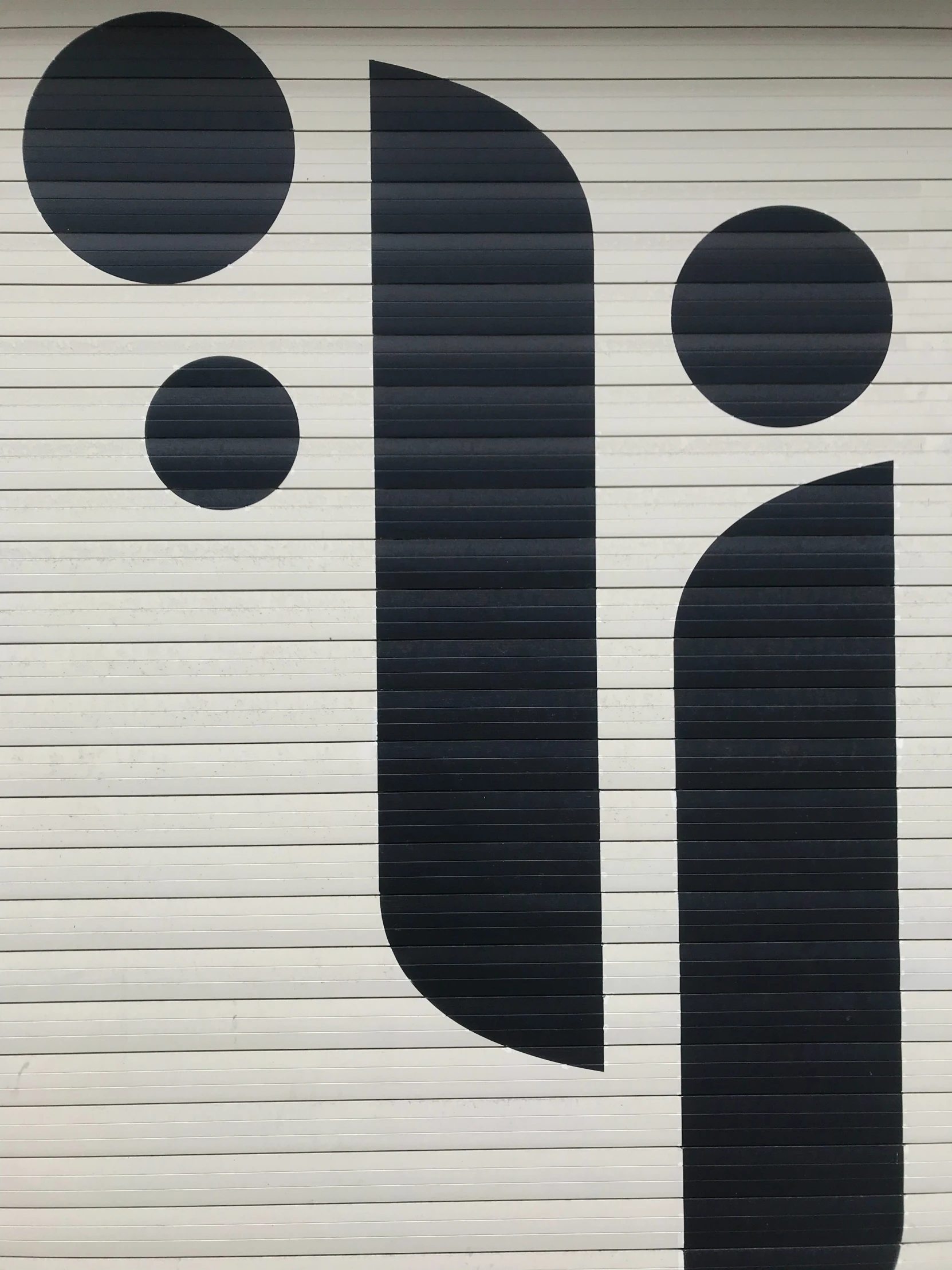 a garage door with a sign painted on the front