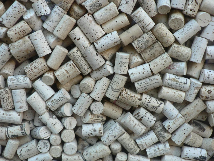 several small, dark, white corks all over