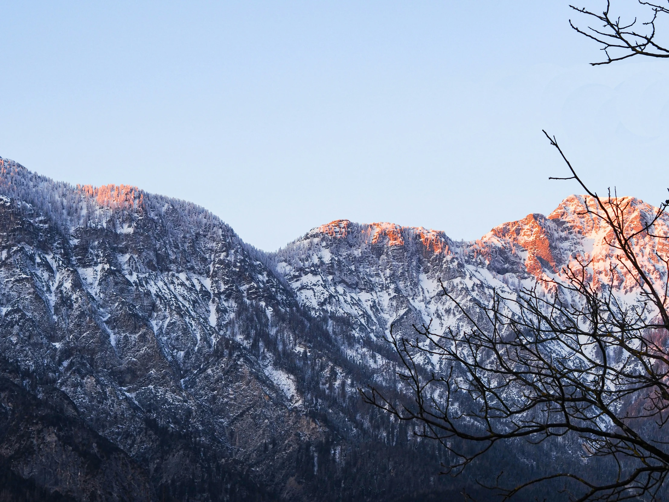 a mountain range that is covered in snow