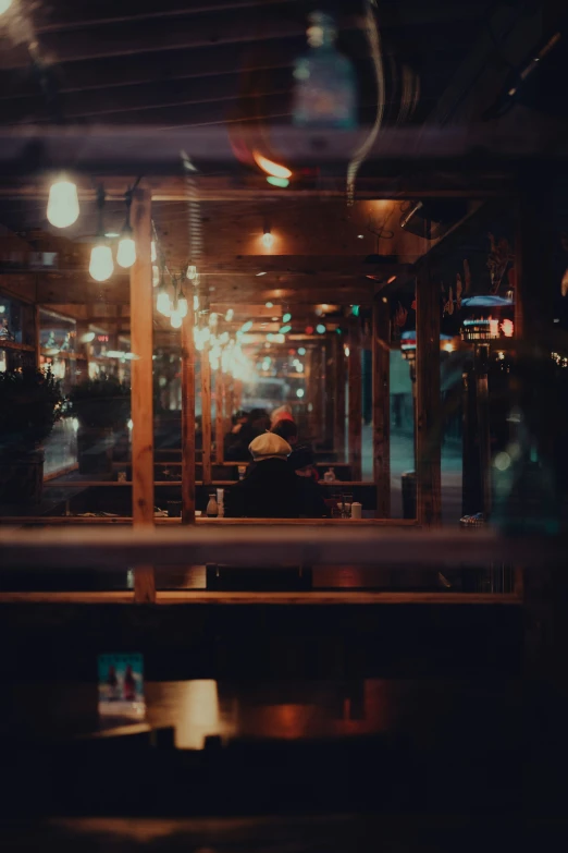 a restaurant with lots of lights on the ceiling