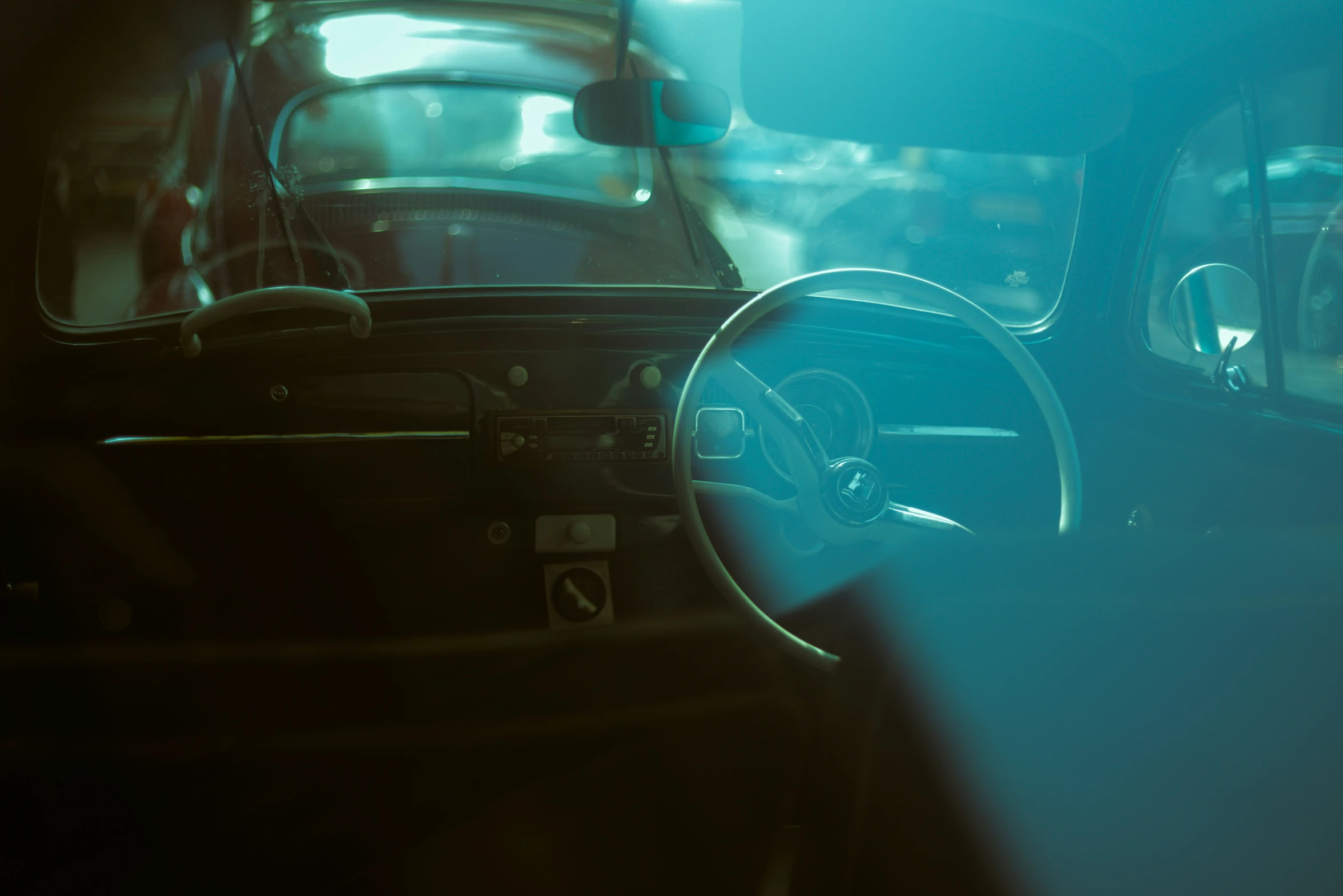 a view through the glass of an old car