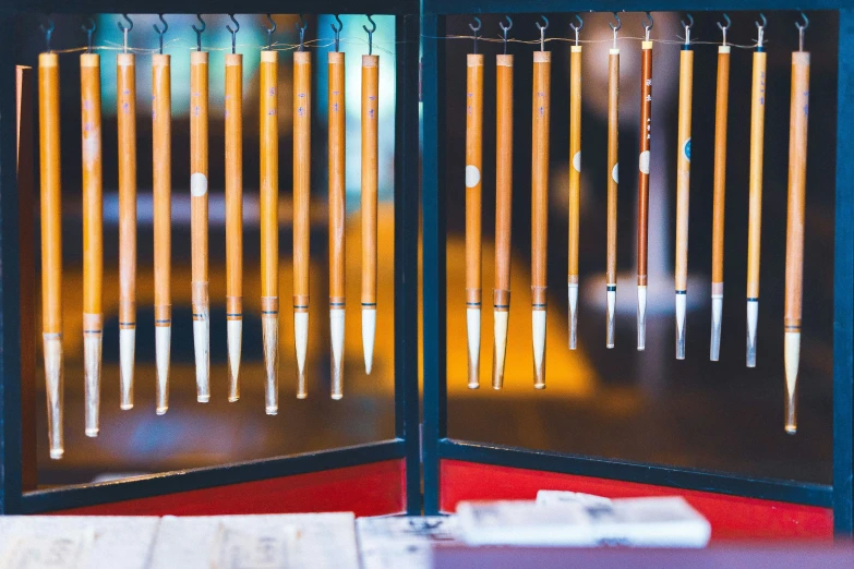 a display of glass tubes hanging on to a building