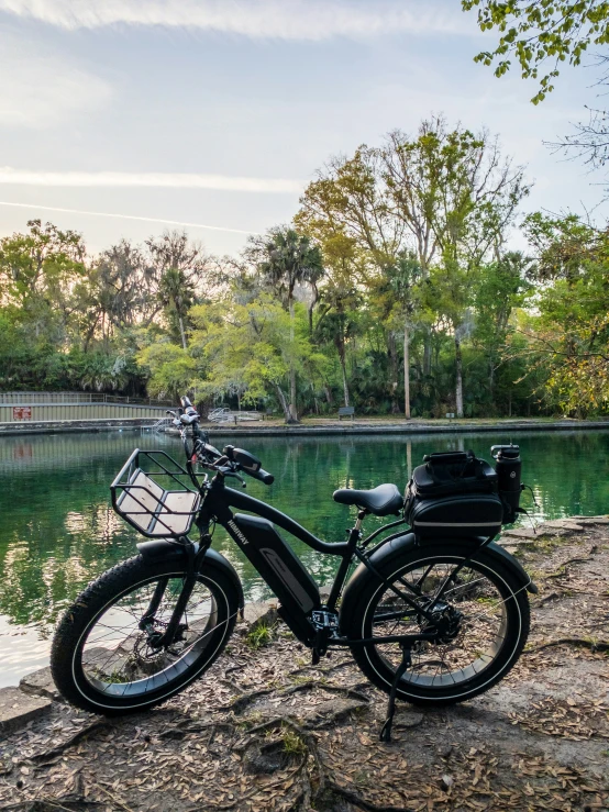 there is a motor bike parked near the water