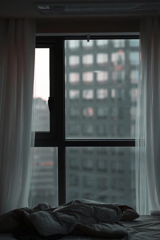 a window view of a city skyline seen through it