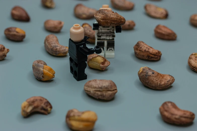 a nut dispenser is shown surrounded by nuts
