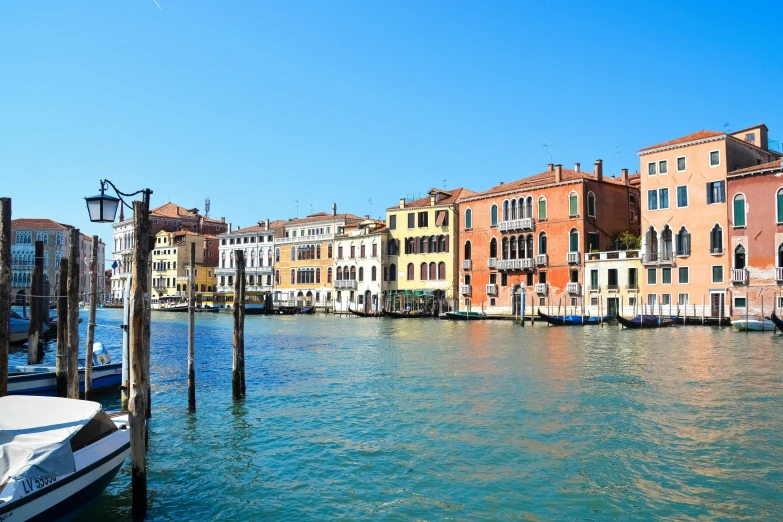 a body of water with many colorful buildings in the background