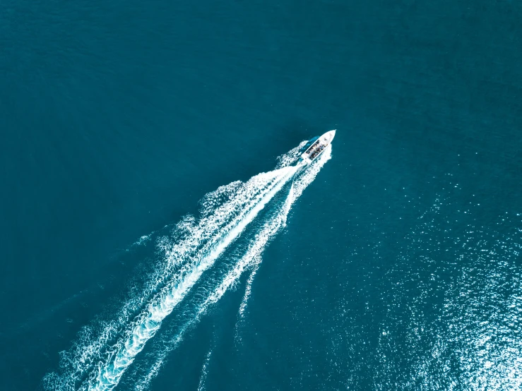 the view from above is of water jet skiing