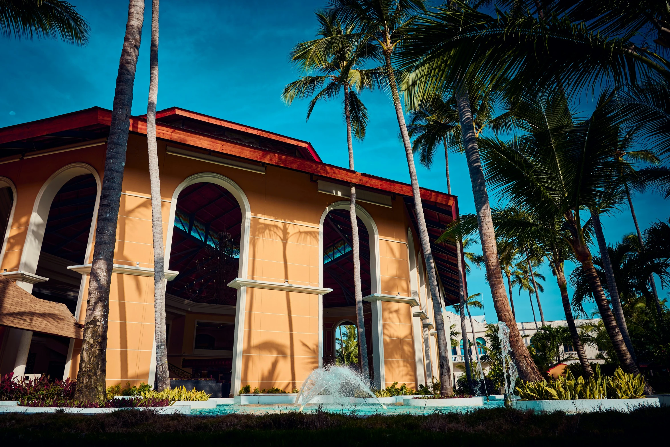 the outside of a large building with trees around