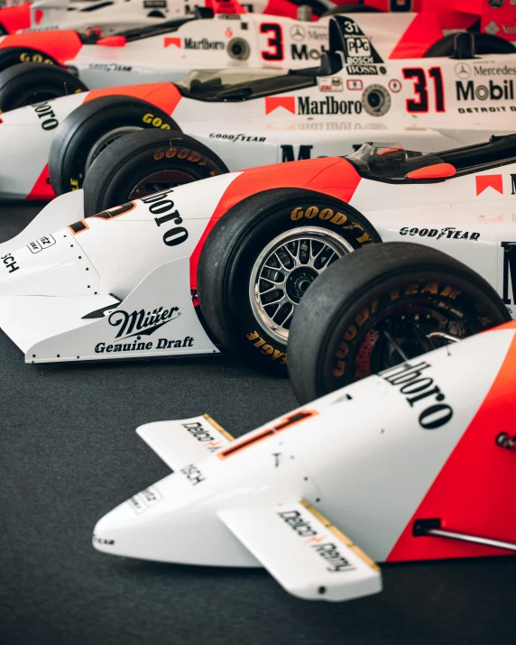various type of race cars are shown with numbers on them