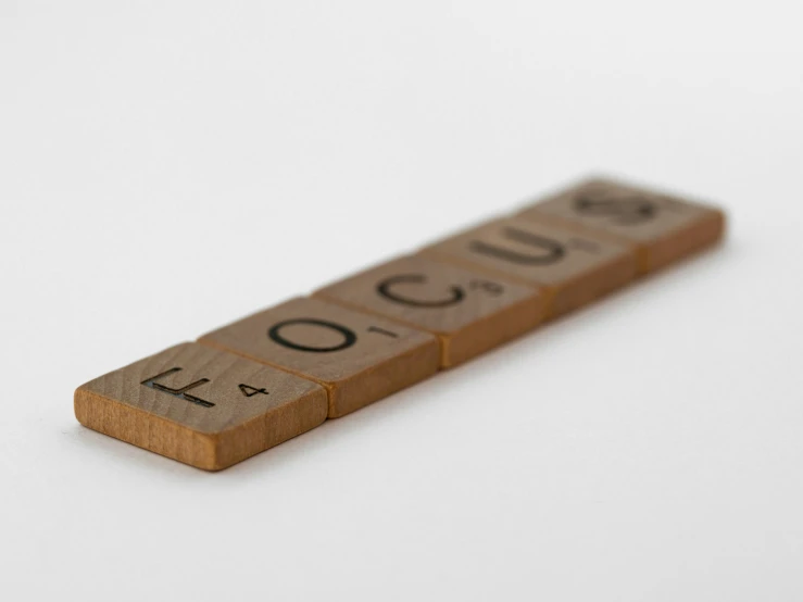 wooden block labeled with words such as focus