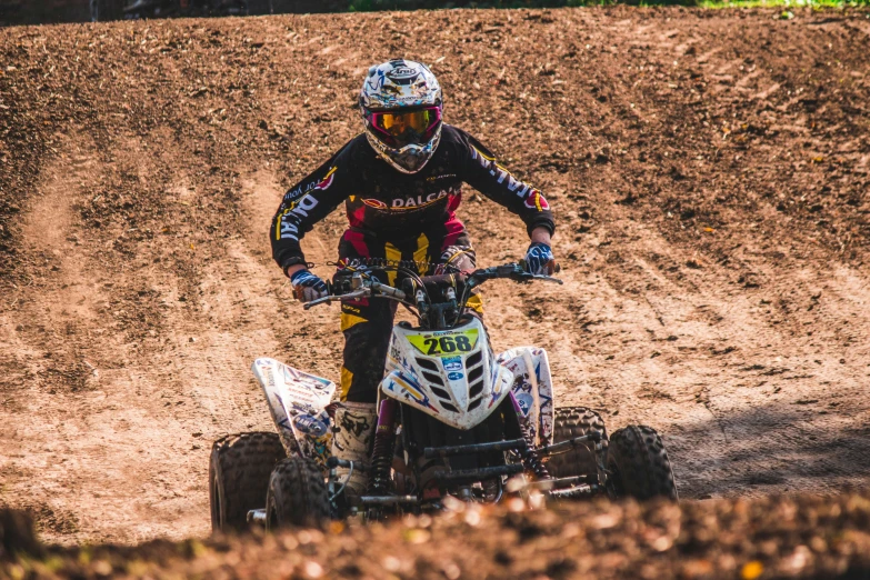 person riding a four wheeler in the dirt