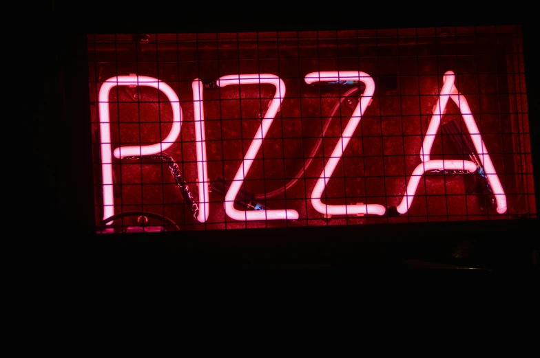 a close up of a neon sign on a building