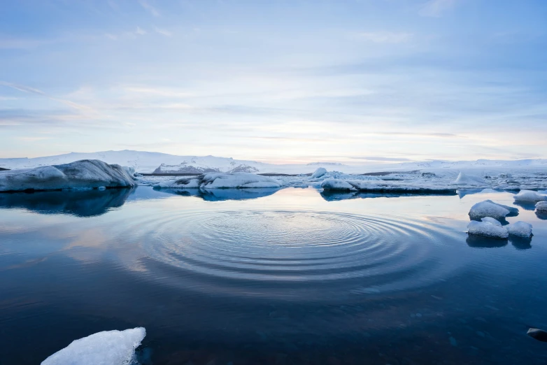 a lake with some ice bubbles in it