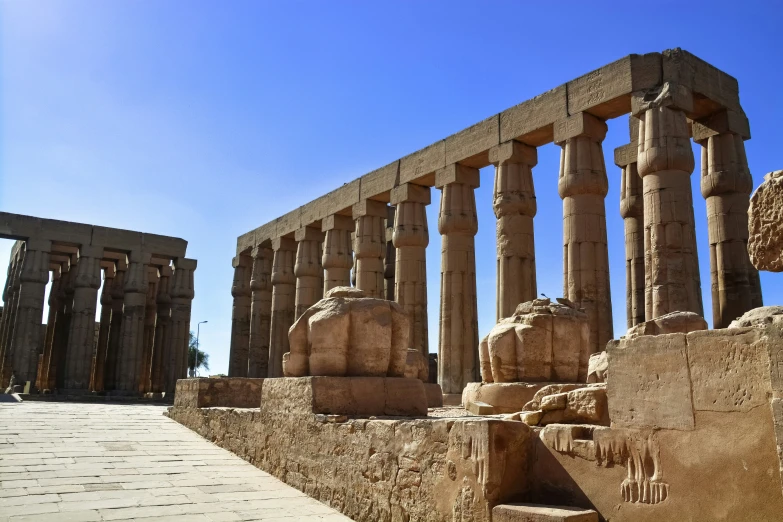 a row of ancient greek pillars on an island