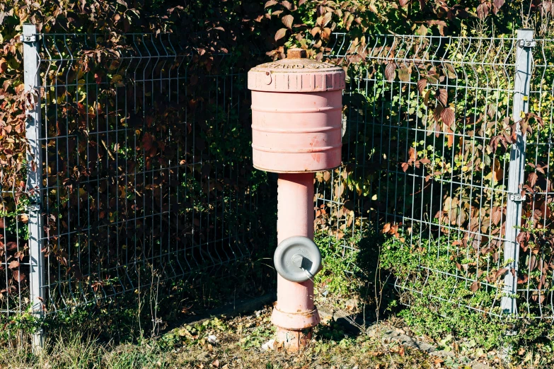 an out house toilet in a grassy field