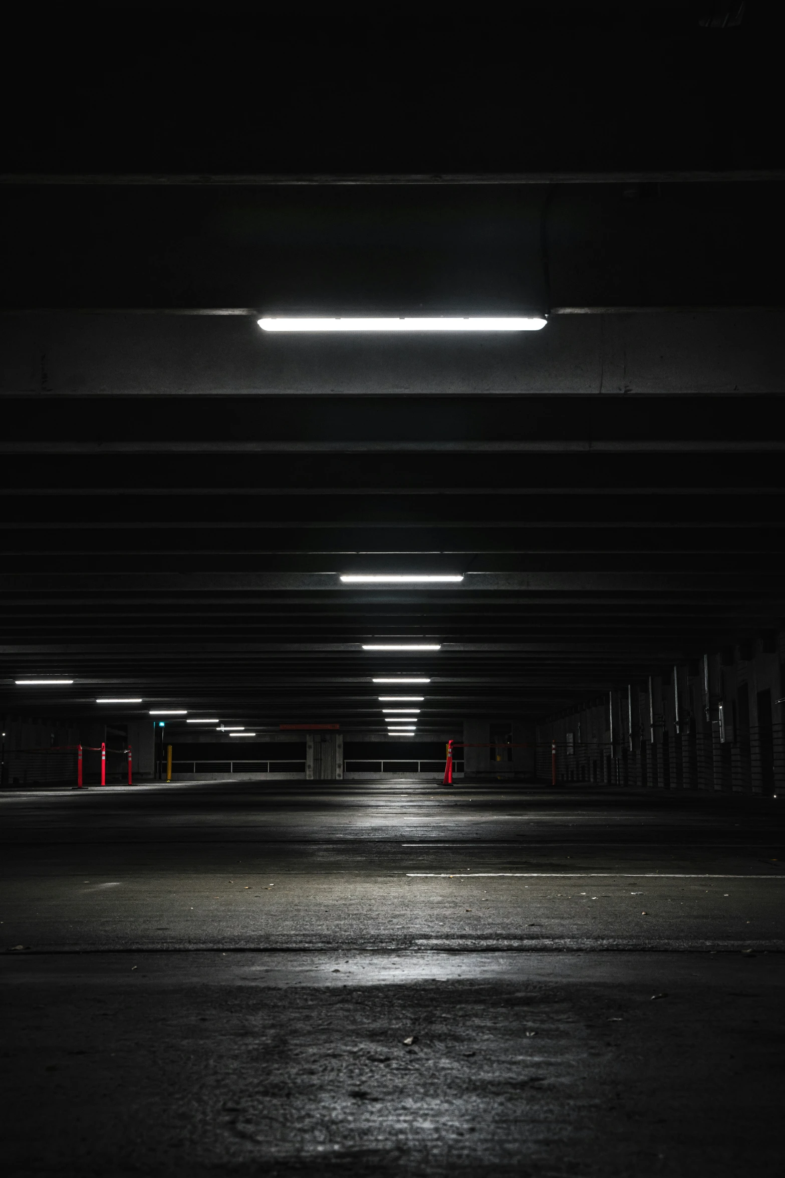 an empty parking garage with bright light coming from it