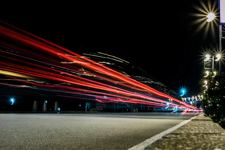 a city street at night with a lot of lights