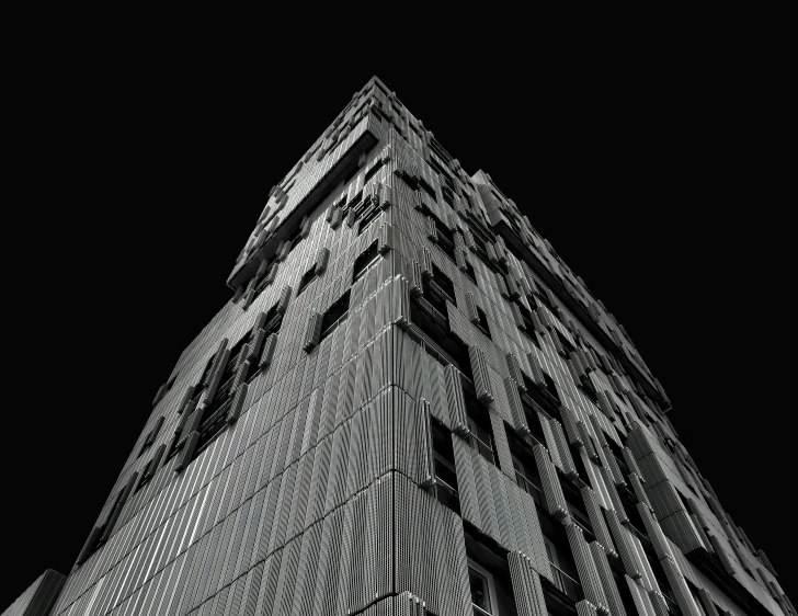 a very tall building that is in the dark