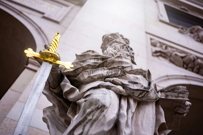 a statue with a sword sticking out of it