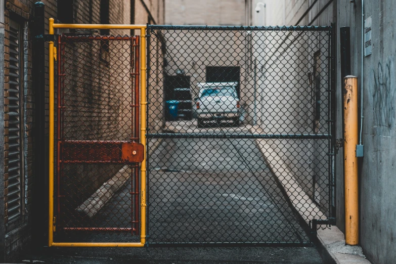 a chain link fence surrounds a closed parking lot