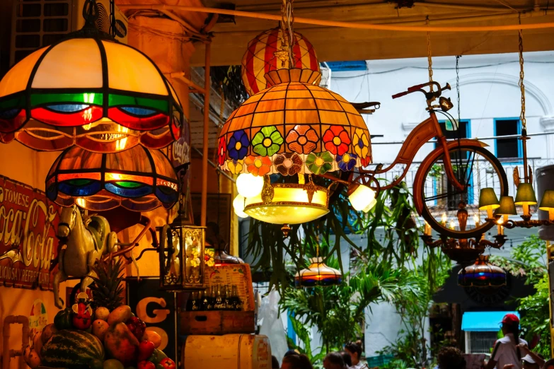 a variety of lamps hung in a store