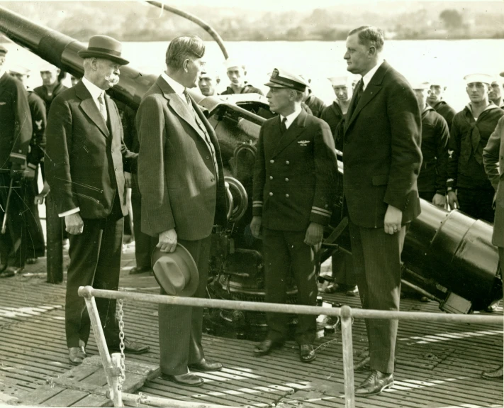 a bunch of men that are standing near a jet