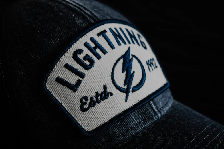 the cap is showing the lightning emblem on it