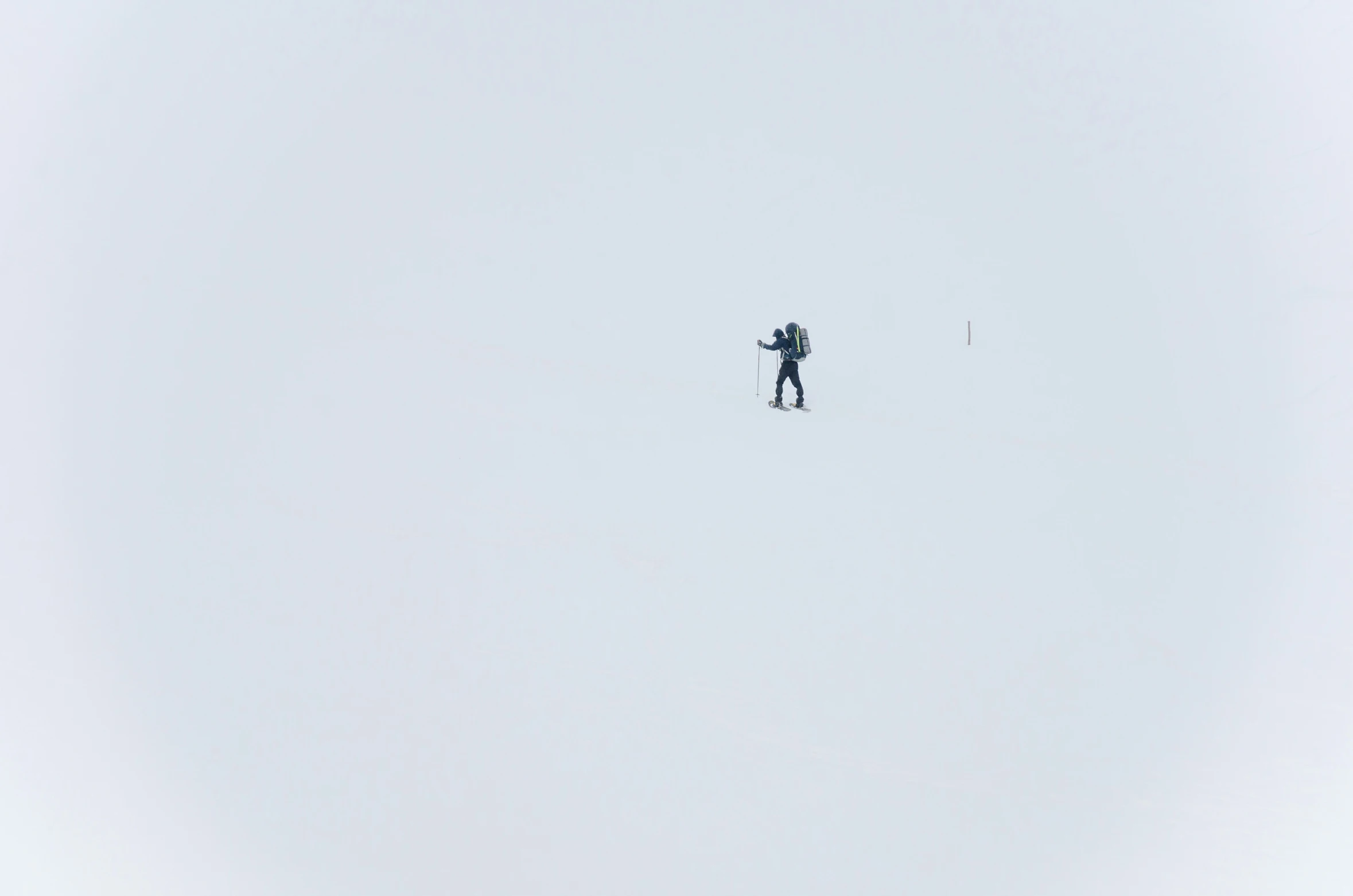 a person flying a snow board on a clear day