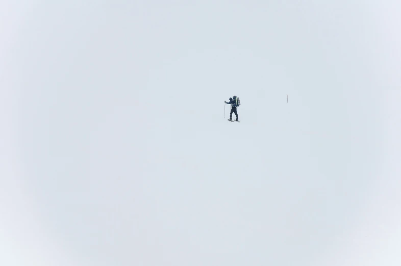 a person flying a snow board on a clear day