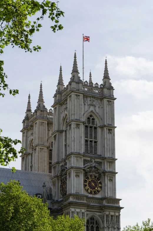 a cathedral is set into the sky with an american flag