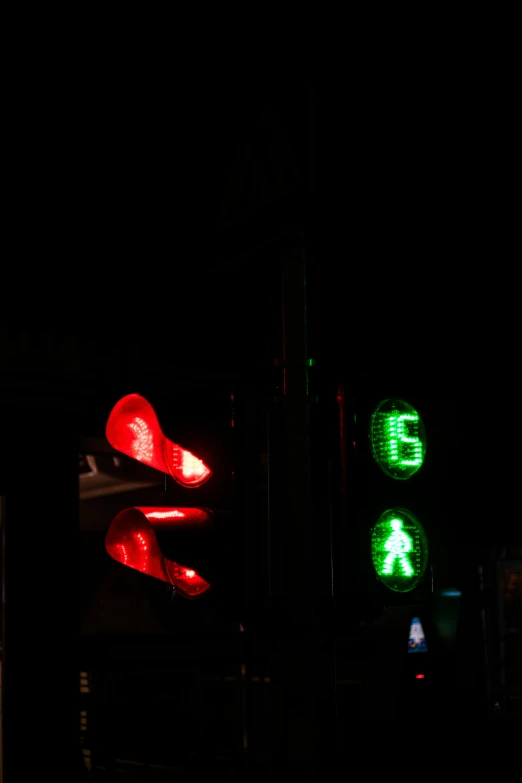 a close up of a traffic light with street signs