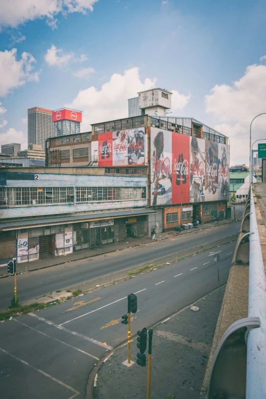 a big building in a city next to the road