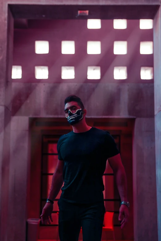 a man is walking into a doorway with a mask on