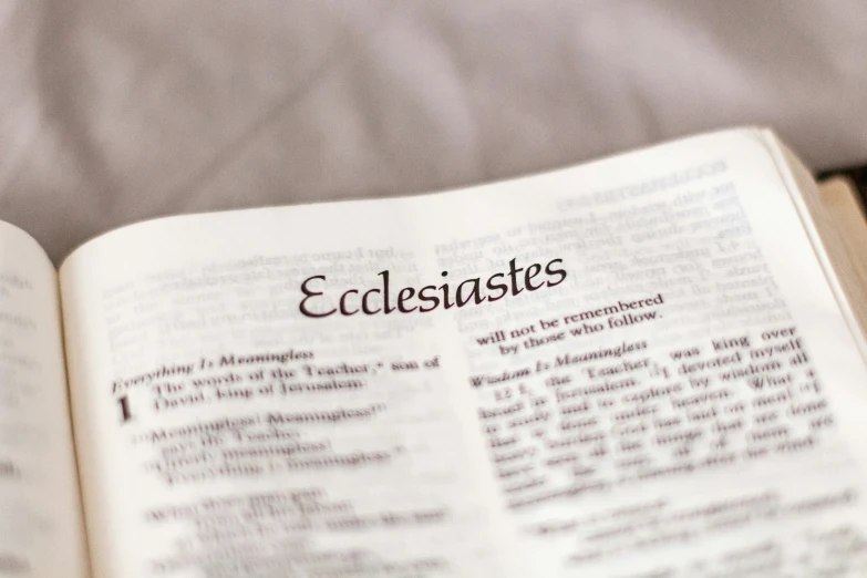an open bible that reads espesisites on it