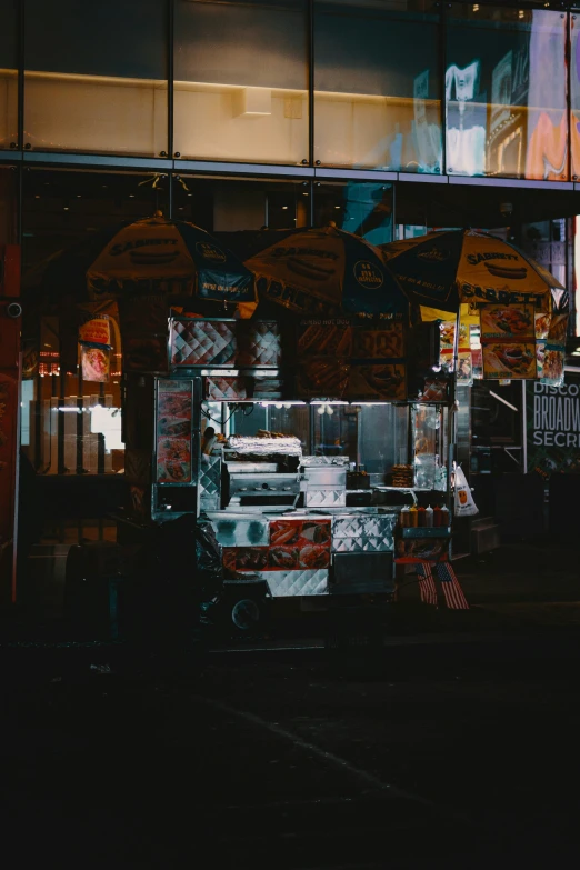 a food stand is displayed on the sidewalk