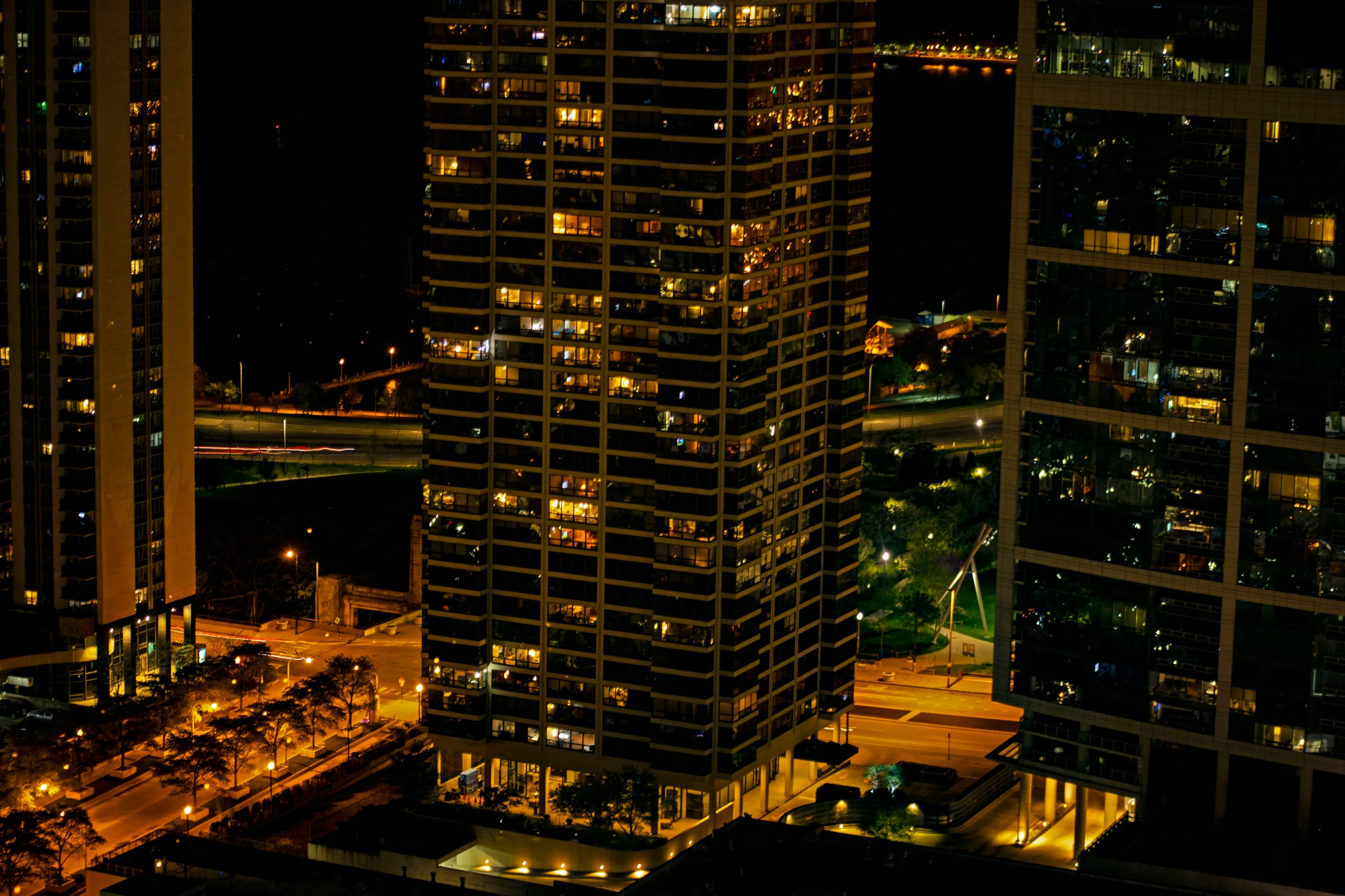 an aerial view of city lights from an urban building