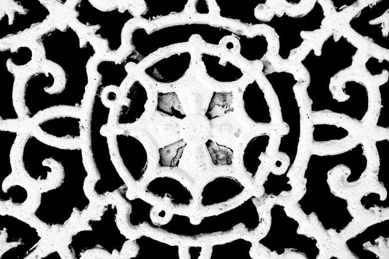 a black and white po of the circular design on the front of a door