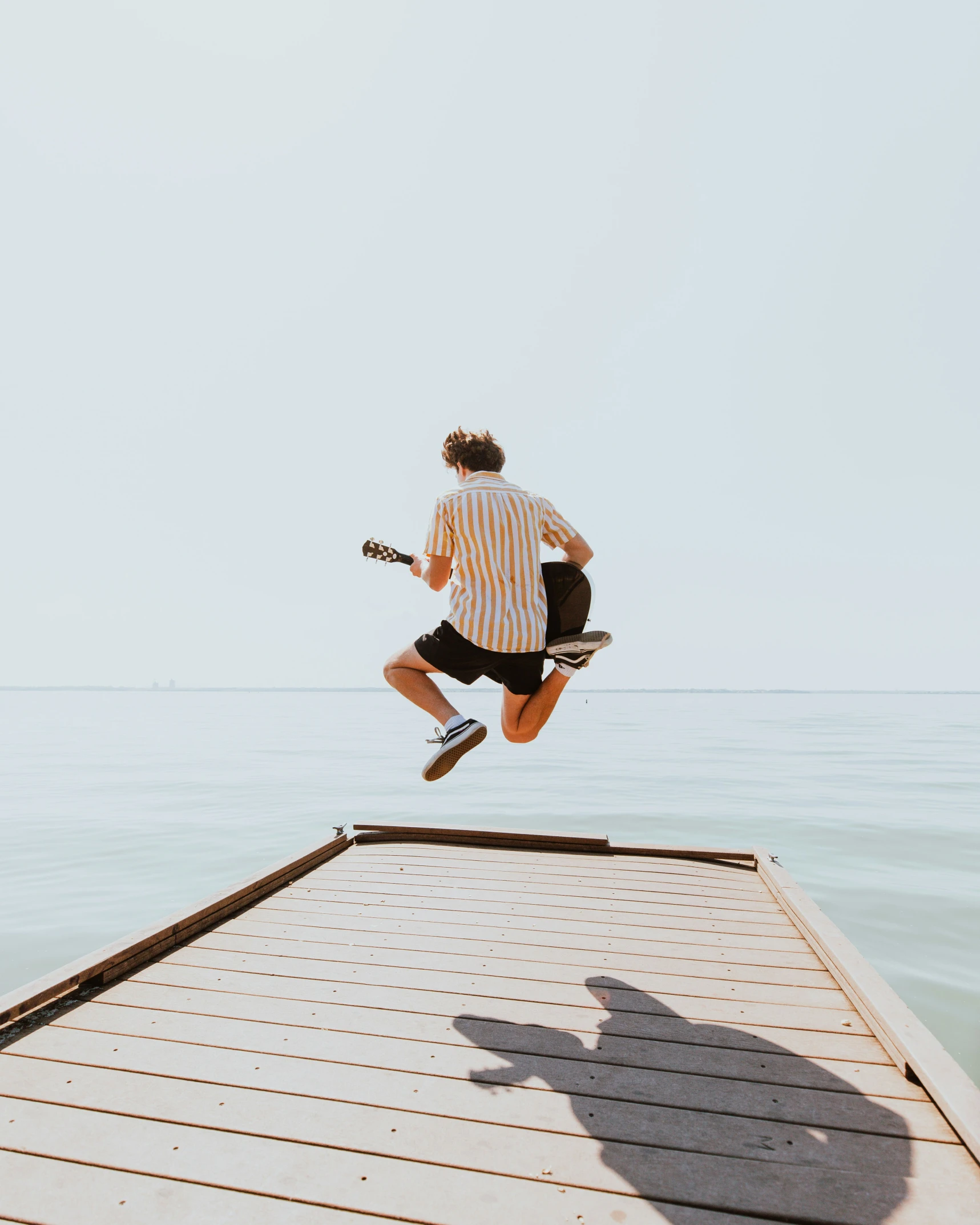 a person is jumping in the air on a skateboard