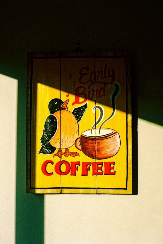 the coffee sign has two birds in it