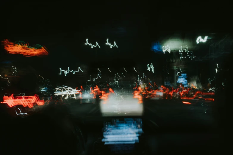 cars passing at night in the city on a street