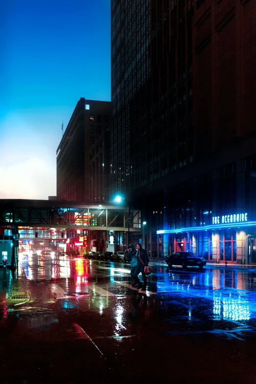 a rainy city street with some buildings and cars