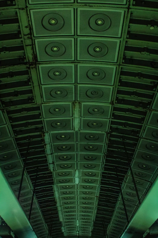 a pograph of an empty train station with its ceiling